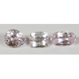 Lot of (3) unmounted kunzites Including (1) pear-cut kunzite, weighing 22.76 cts., (1) oval-cut