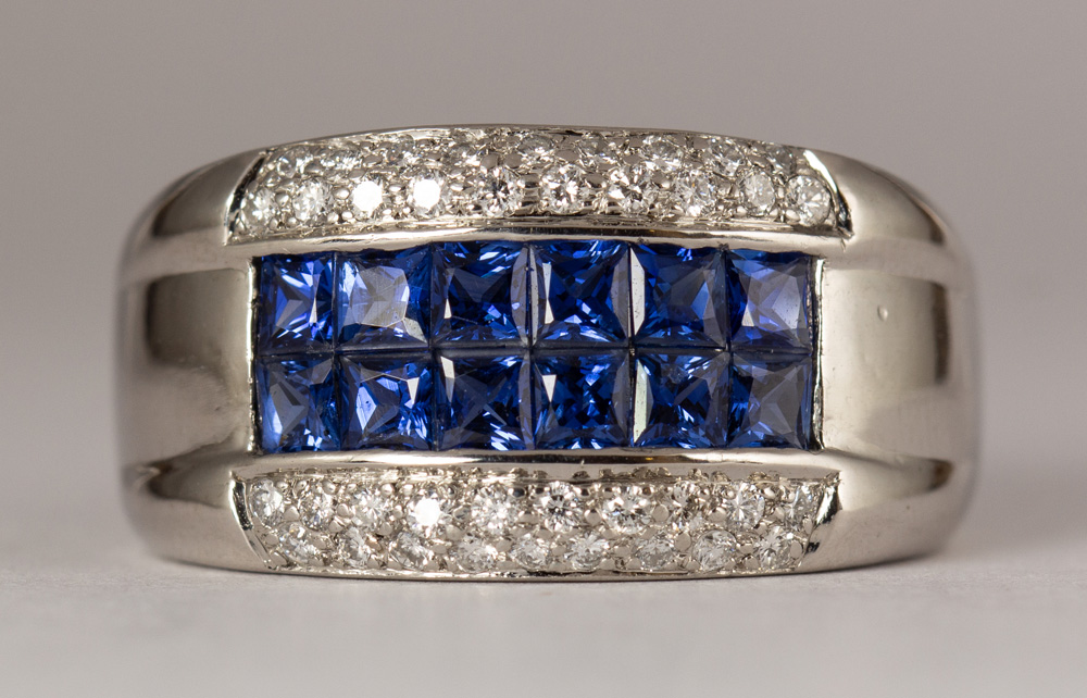 Sapphire, diamond, platinum ring Featuring (12) French-cut sapphires, weighing a total of