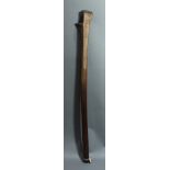 A Fijiian rootstalk war club, accented with long, incised striations, 39"h; Provenance: Richard I.M.