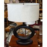 Modern lamp, having a single light above a geometric form standard, 27"h