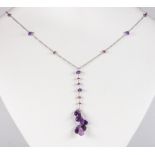 Amethyst, tourmaline, 18k white gold necklace Featuring (8) amethyst briolettes, ranging in size