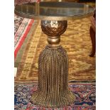 Contemporary gilt metal side table, the circular noir marble top above the gilt metal base of tassel