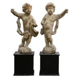 A pair of continental Baroque wood carved putti late 17th / early 18th century, each in classic