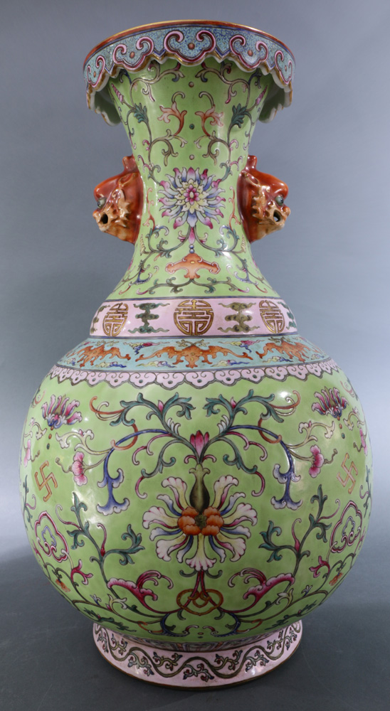 A Chinese Large turquoise ground enamelled vase, painted with peony flows, bats and foliage scrolls,