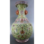A Chinese Large turquoise ground enamelled vase, painted with peony flows, bats and foliage scrolls,