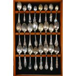 (lot of 24) A glazed spoon rack with a collection sterling souvenir spoons, including (10) San