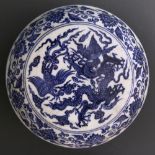 A Chinese blue and white lidded porcelain box, of circular shape, the cover painted with dragon