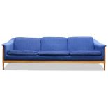 Dux Scandanavian Modern sofa, having blue wool upholsterey, with three seats, and rising on