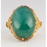 Jadeite, 18k yellow gold ring Featuring (1) oval jadeite cabochon, measuring approximately 19 X 12
