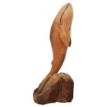 A carved wood sculpture depicting a whale, unsigned 39.5"h