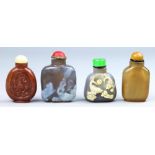 (Lot of 4) Four Chinese hardstone snuff bottles, including three agate, two are carved with fish and