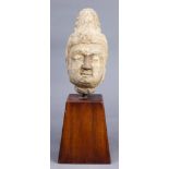 A Chinese stone buddha head with wood stand 5.5"w x 15.75"h