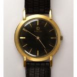 Omega 14k yellow gold leather wristwatch Dial: round, applied baton hour markers, gold baton