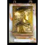 Victoire de Florence gilt relief plaque, with an auction label reading "Gilt-bronze and onyx plaque,