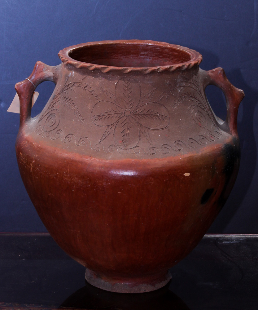 Central American redware ovoid vessel, having an incised floral decorated border with two applied