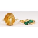 (Lot of 2) Citrine, emerald, 14k yellow gold rings Including 1) ring, featuring (1) oval-cut