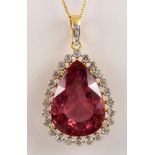 Tourmaline, diamond, 18k yellow gold pendant-necklace Featuring (1) pear-cut pink tourmaline,