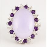 Jadeite, amethyst, diamond and 14k white gold ring Centering (1) oval lavender jadeite cabochon,