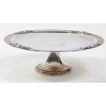 An Art Deco Tiffany and Co sterling silver compote, circa 1939, the footed dish form tray with