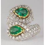 Emerald, diamond, 18k white gold ring Featuring (2) pear-cut emeralds, weighing a total of