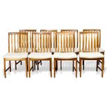 (lot of 8) Modern dining chairs, each having a slatted back, above a cream upholstered seat and
