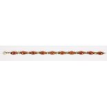 Amber, 14k yellow gold bracelet Featuring (10) navette-shaped amber cabochons, measuring