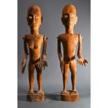 (lot of 2) Pair of Oceanic male and female carved wood dolls, with articulated limbs, 22"h