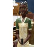 West African (Nigerian) polychrome decorated figural group depicting a female, 52"h