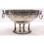 An European Deco silver plate centerpiece, the oviform bowl with ring handles, a stylized leafy