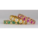 Diamond, emerald, ruby, 18k yellow gold eternity band set Including (1) eternity band, featuring (