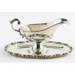 Mexican Conquistador sterling sauce boat with an integrated undertray, each piece chase decorated