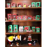 Four shelves of Looney Tunes Christmas collectibles, including Pepe Le Pew, Sylvester the Cat,