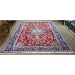 A Persian Meshed carpet, 9'11" x 13'4" (wear)