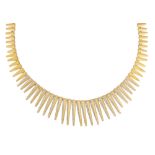 Diamond, 18k yellow gold spike necklace Designed as articulated, graduating spike links, ranging