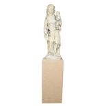 A Madonna and Child figural sculpture on stand circa 1860, executed in stone, with each figure