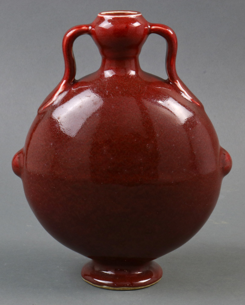 A Chinese copper red glazed porcelain moon-flask vase, of flattened circular shape raised on a low - Image 2 of 5
