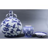 (Lot of 3)A group of Chinese blue and white wares, the first is a bottle vase painted with