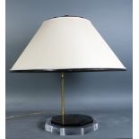 Lamp stand with Chinese style finial and beige lampshade, octagonal clear and blacck base,
