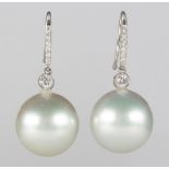 Pair of South Sea cultured pearl, diamond, 18k white gold earrings Featuring (2) South Sea