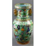 A Chinese turquoise ground cloisonn‚ vase, with a pair of phenix handle and the body enameled with