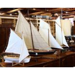 (lot of 4) Model sail boat group, each with cloth masts, most with painted and varnished hull,