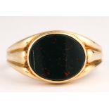 Bloodstone, 10k yellow gold ring Featuring (1) oval bloodstone table, set in a 10k yellow gold