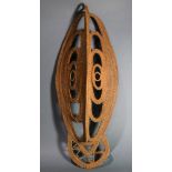 An Abelam, Papua New Guinea yam mask, having an elongated face with open work weaving to the center,