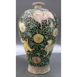 A Chinese meiping shaped vase, overall with black ground painted with mystical beasts and