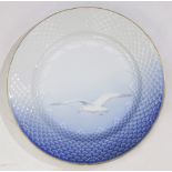 (lot of 11) Bing and Grondahl Seagull porcelain dinner plates, each having a gilt rim with a sky