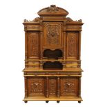 A monumental continental Renaissance style buffet circa 1890, executed in walnut, the superstructure