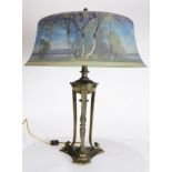 A Pairpoint Northwoods reverse painted table lamp, the well executed 18"w shade depicting a lake