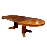 Arts and Crafts Gustav Stickley split pedestal dining table model 656, having four 11" leaves and