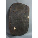 A Simbai Papua New Guinea flat black shield, 48"h x 29"w; Provenance: Richard I.M. Kelton