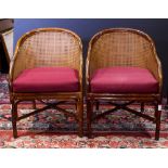 Pair of McGuire style bamboo chairs, each having a continuous back with a burgundy drop in
